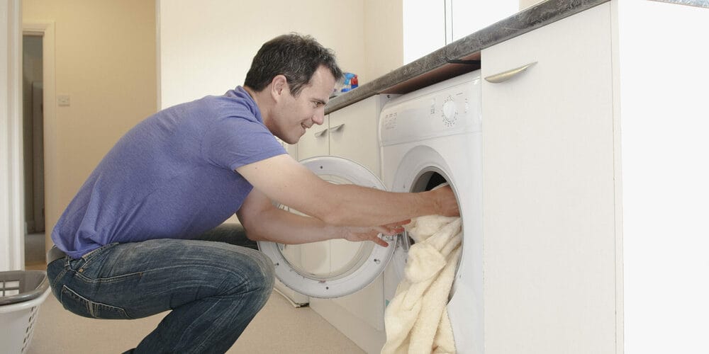 Put the blanket in the washing machine Put the blanket in the washing machine